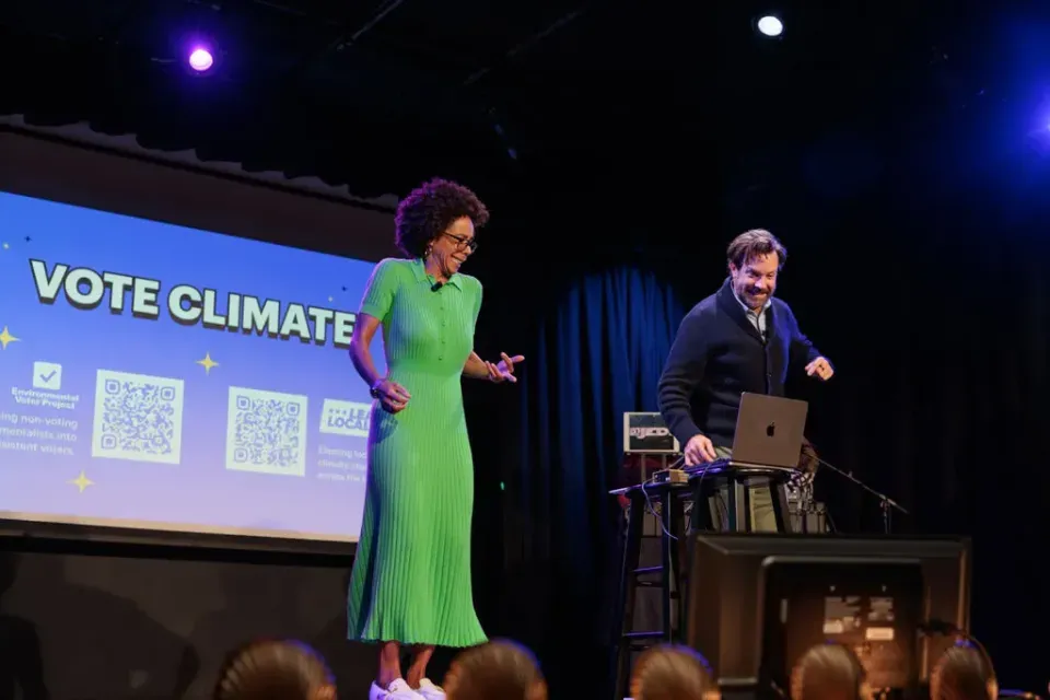 Sudeikis v. Johnson dance off at our LA Climate Variety Show. Lead Locally programmed Dance Dance Revolution boards so that every step sent a text to a voter to remind them to #VoteClimate. (Photo: Elisa Ferrari)