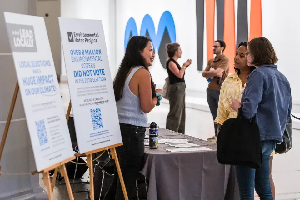 EVP and Lead Locally volunteers talk with attendees at the book launch at Brooklyn Museum.